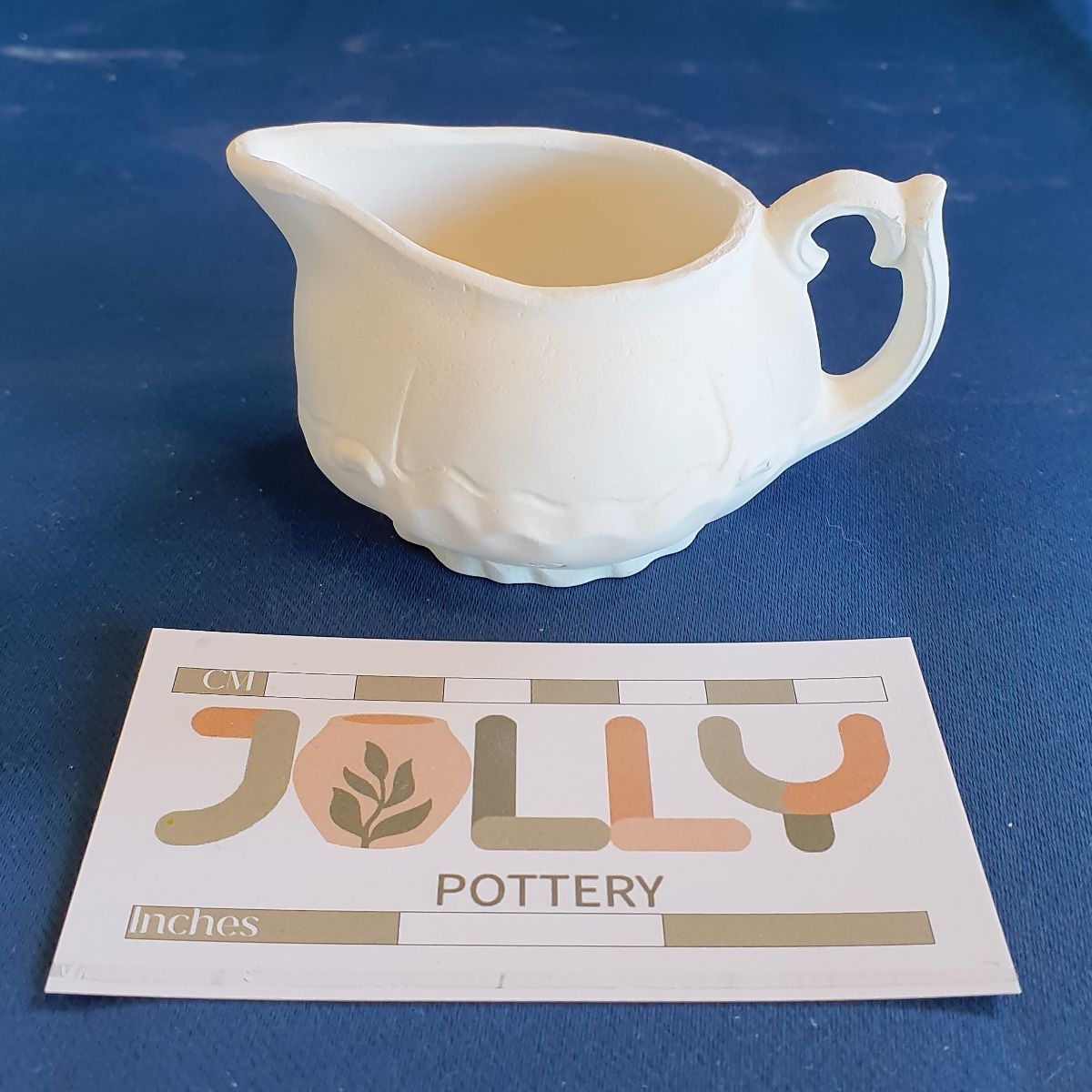 Cream Pot and Saucer