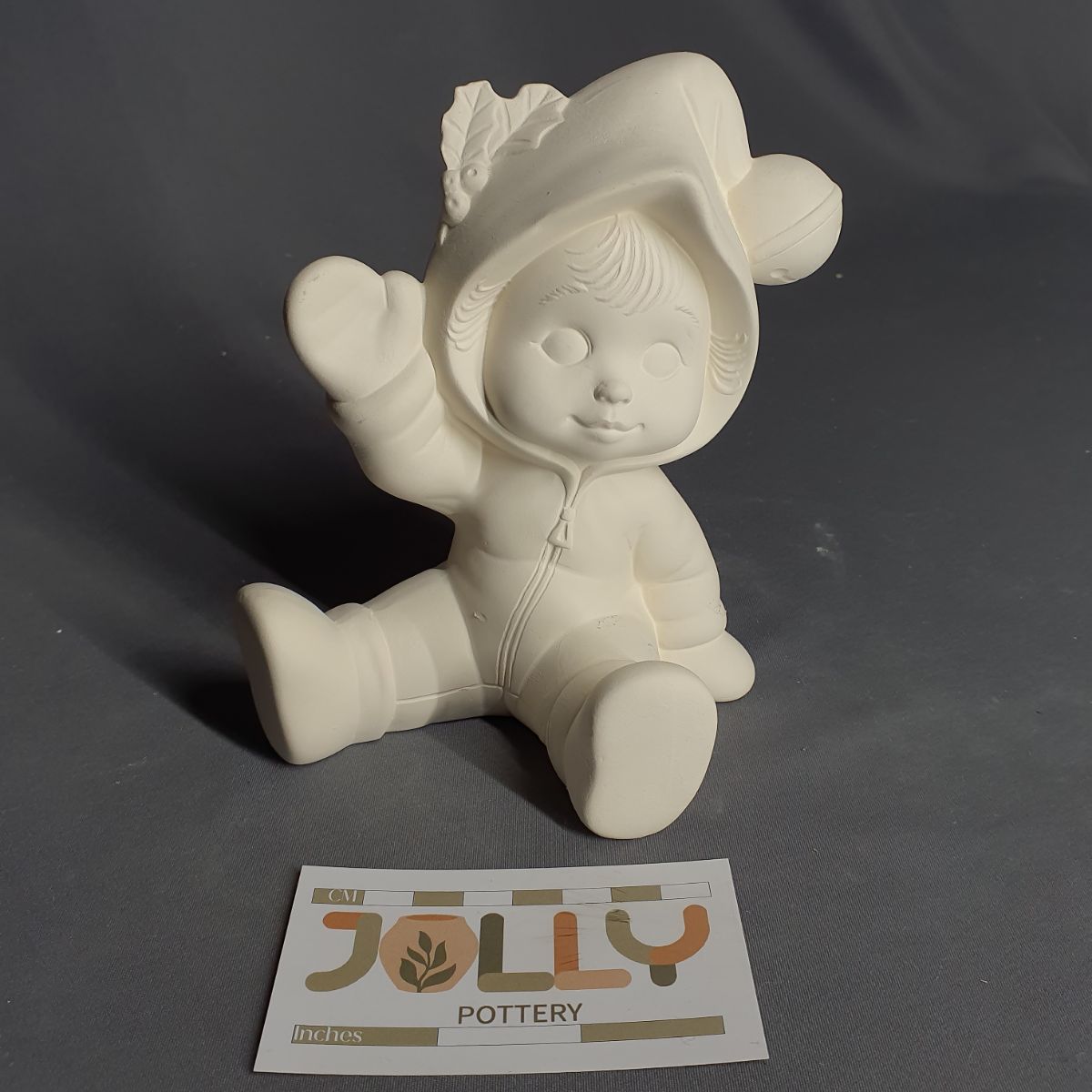 Tot in Snowsuit Waving